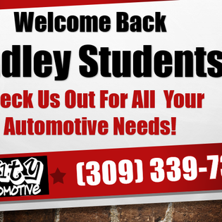 Sign with black text on a white background, red accents, advertising automotive services to students, with phone number.