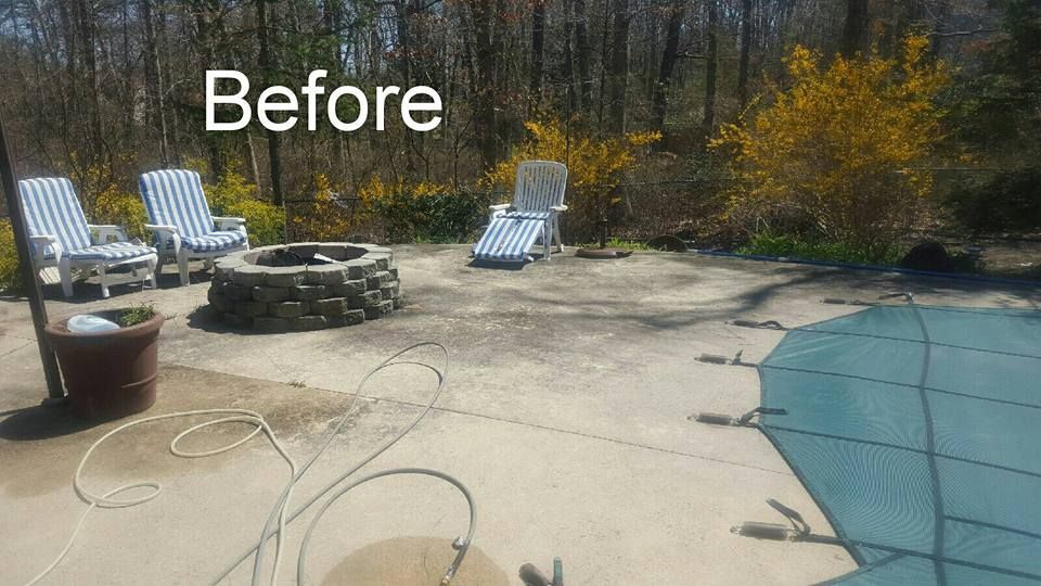 A before picture of a patio with chairs and a fire pit