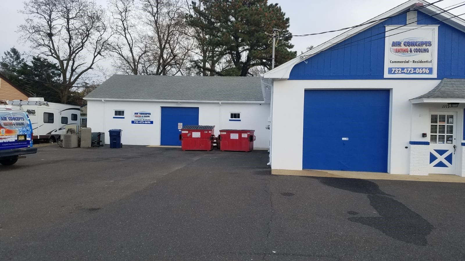 A blue and white building with a sign that says ' rv repair ' on it