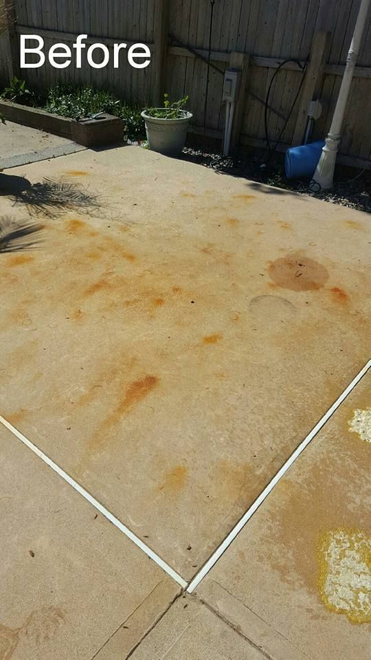 A picture of a concrete driveway before being cleaned.