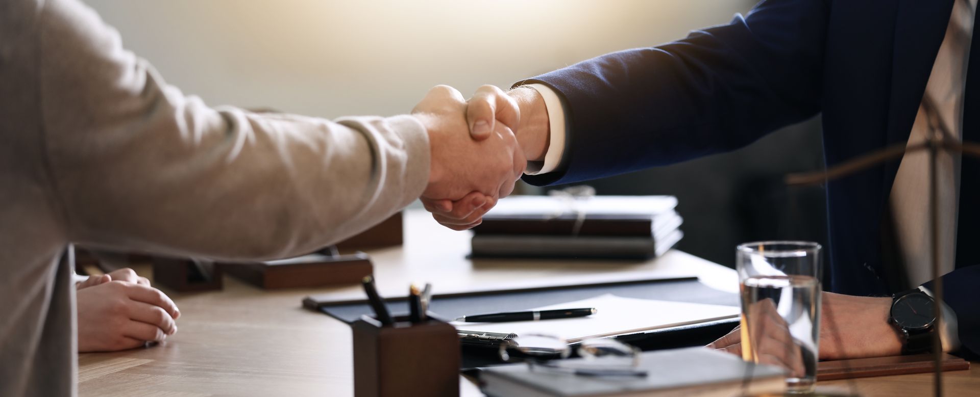 Employment Contract Lawyer reviewing a workplace agreement with a worker.