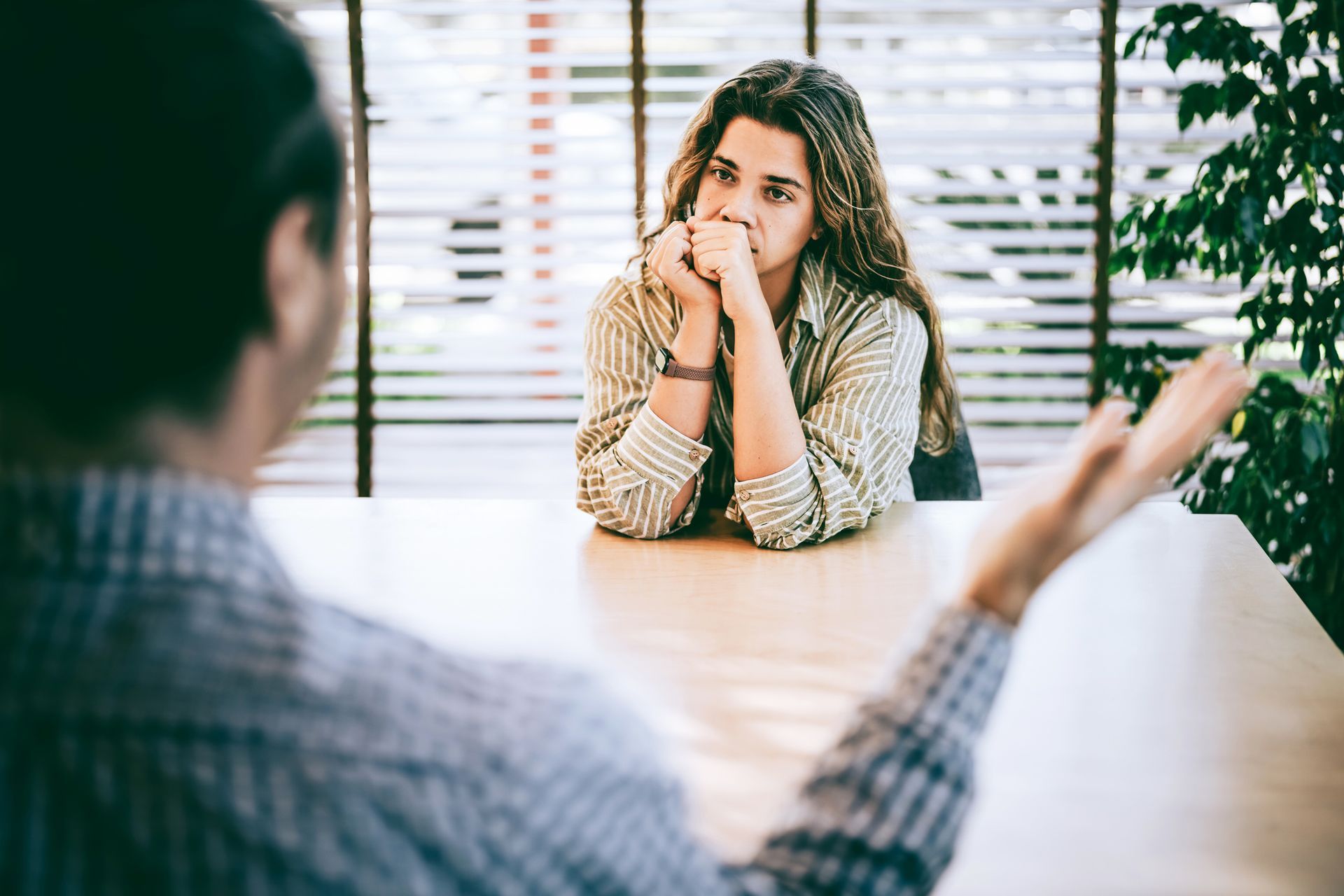 A boss is firing an employee. A boss is firing an employee.