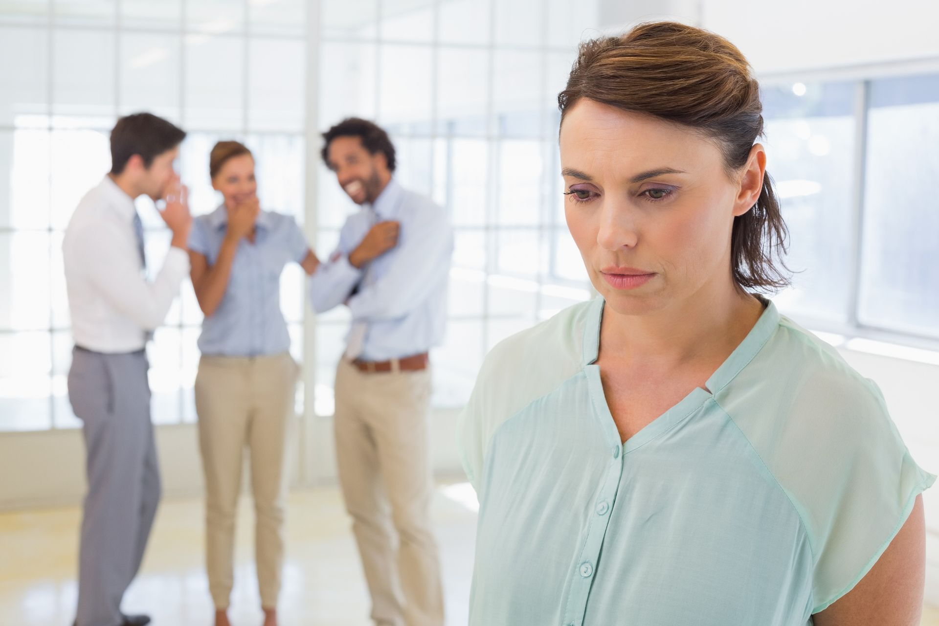 Colleagues gossiping with potential for a discrimination law case at Allen D. Arnold Attorney at Law in Montgomery, AL Colleagues gossiping with potential for a discrimination law case at Allen D. Arnold Attorney at Law in Montgomery, AL