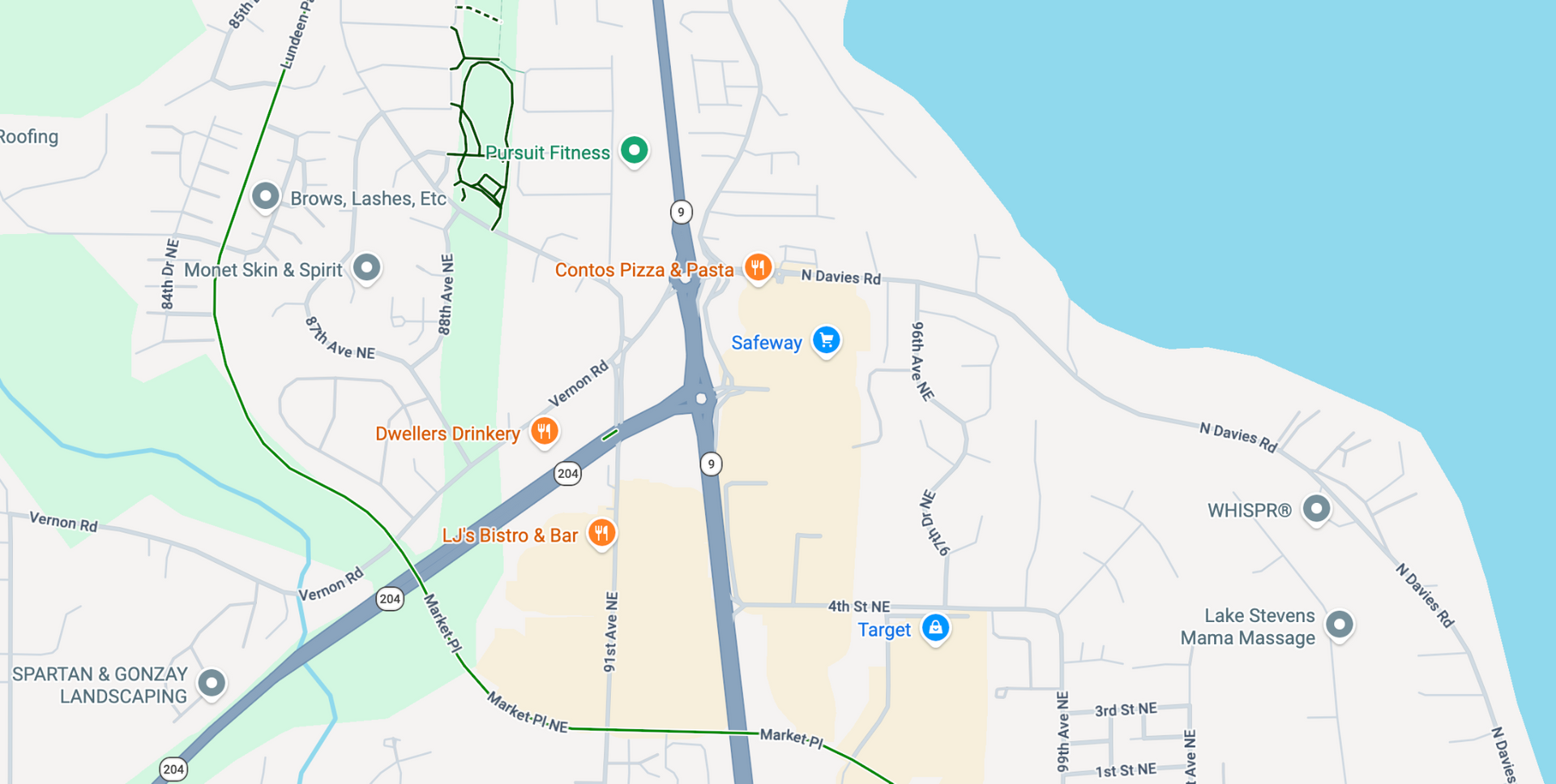 Map of a coastal area with roads, trails, and park locations marked in green, blue, and orange.