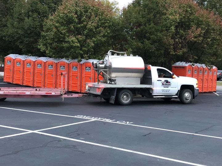 Woman Standing Next To A Truck — Owensboro, KY — Mitzi Autry's Portable Toilets