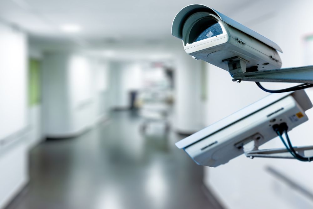 Two Security Cameras Are Sitting in a Hallway in a Hospital — Cambush Security Solutions NT in Alice Springs, NT
