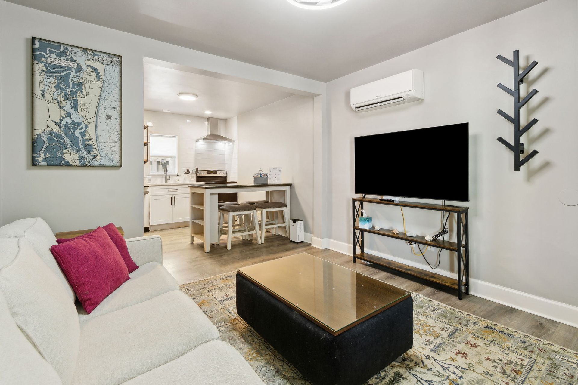 living room with sofa and an ottoman