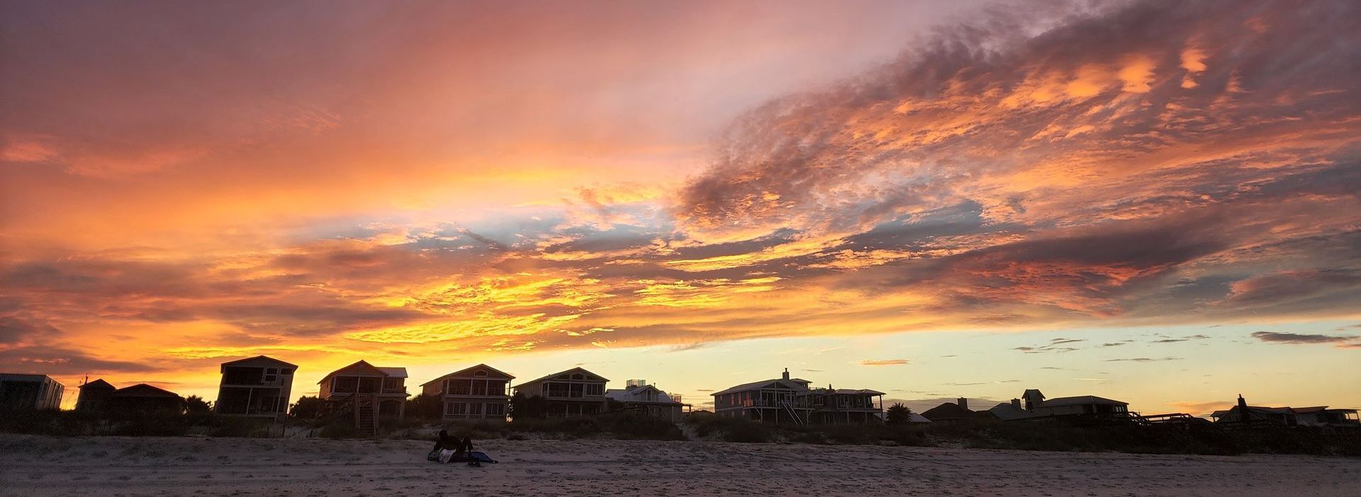 fiery sunset sky over a beach