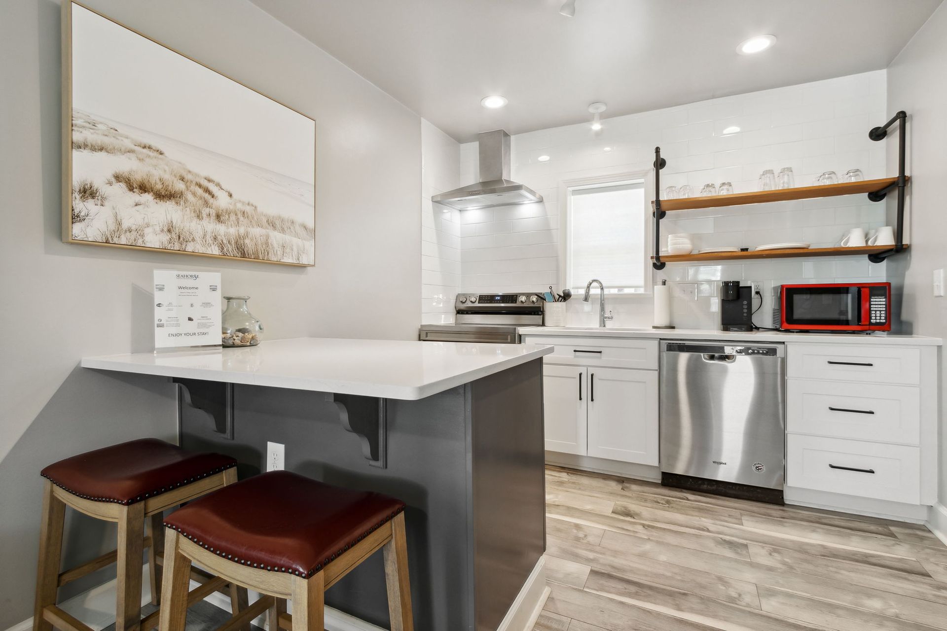 Kitchen/dining area with bar stools