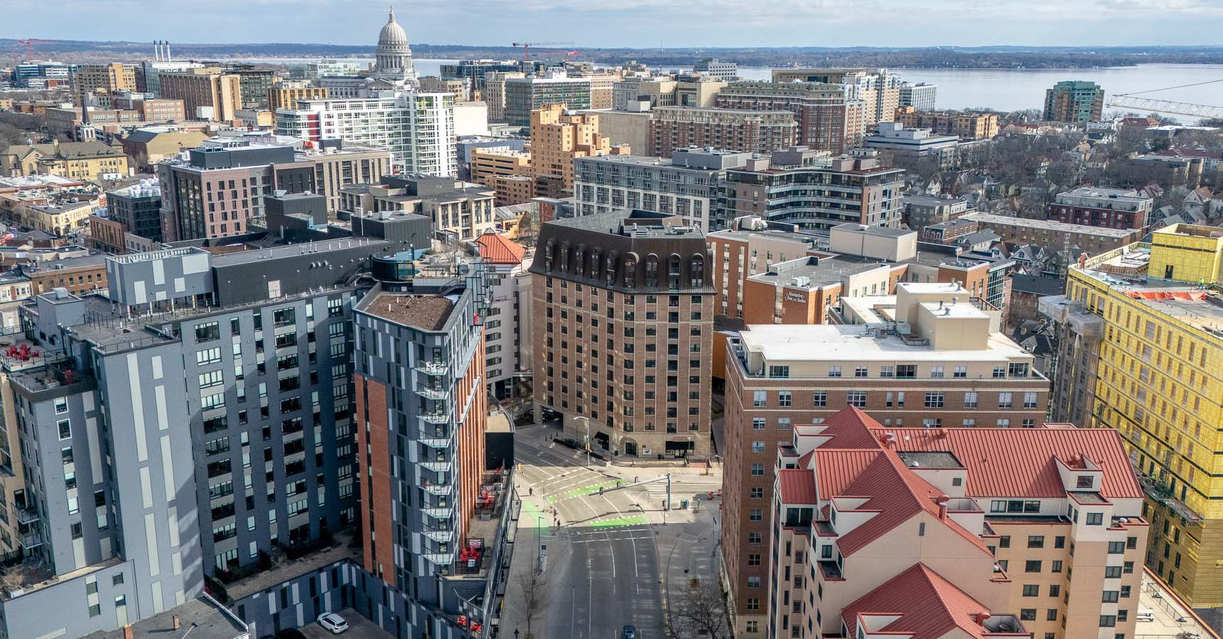 An aerial view of a swimming pool on the roof of a building