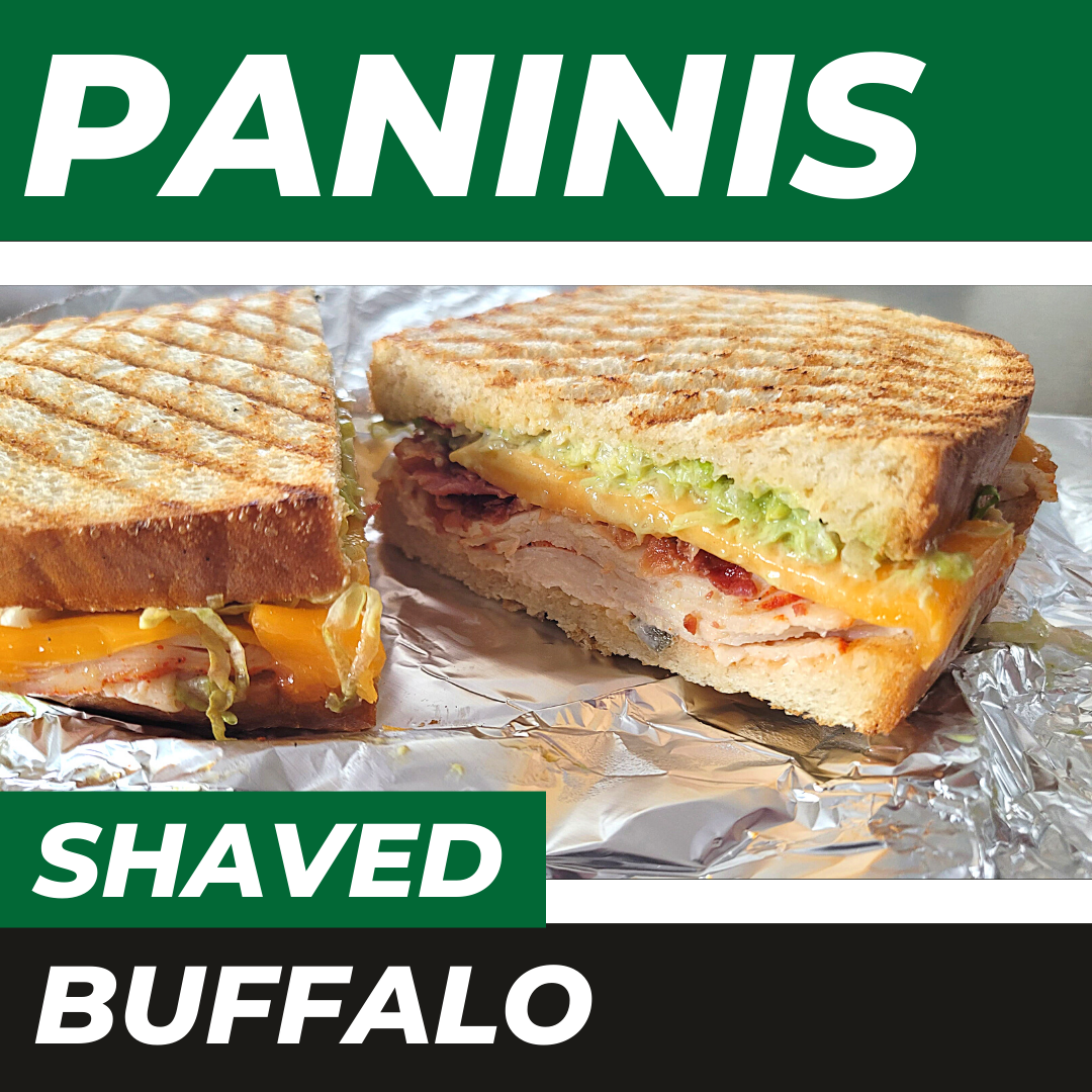 A grilled panini cut in half on foil, labeled with 