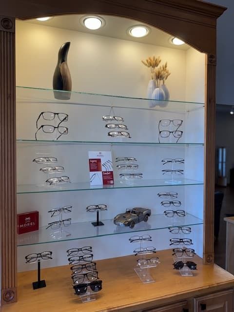 A display case filled with glasses and sunglasses