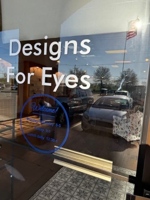 A sign that says designs for eyes on it