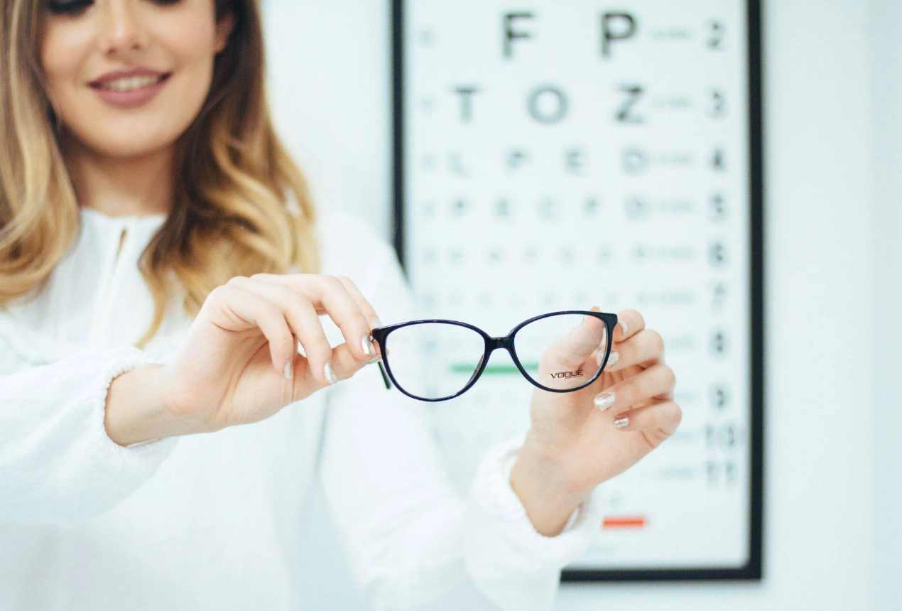 A woman is getting her eyes checked by an ophthalmologist.