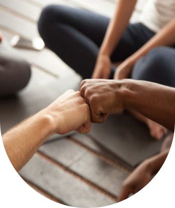 two hands fist bumping