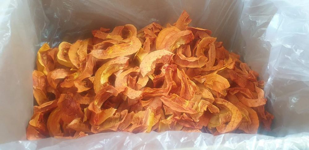 A Box Filled with Dried Paw Paw Slices in A Plastic Bag — Mareeba Golden Dried Mangoes in Mareeba, QLD