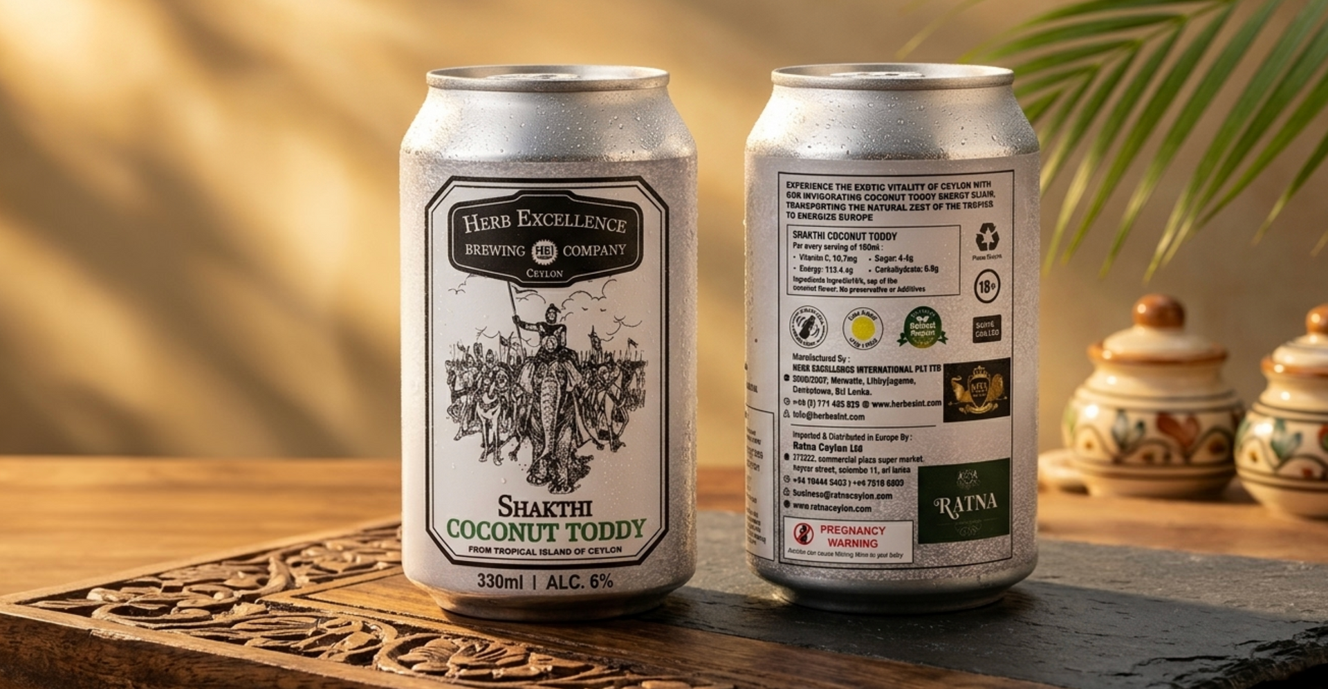 Two white canned drinks on a wooden table, one showing a black label with a botanical design.