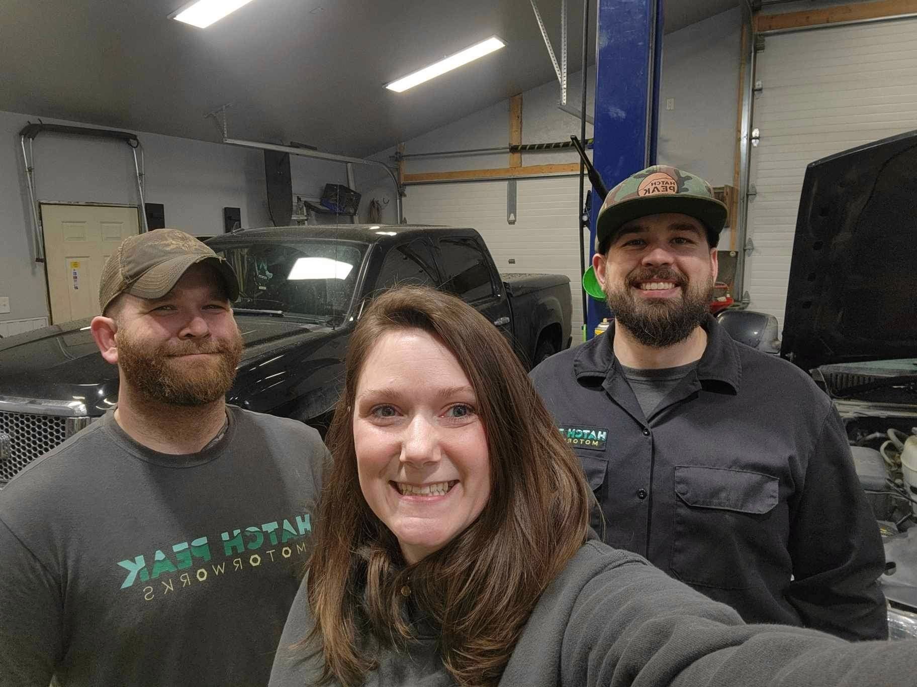 Three Auto Technicians Smiling Together Inside Workshop | Hatch Peak Motorworks