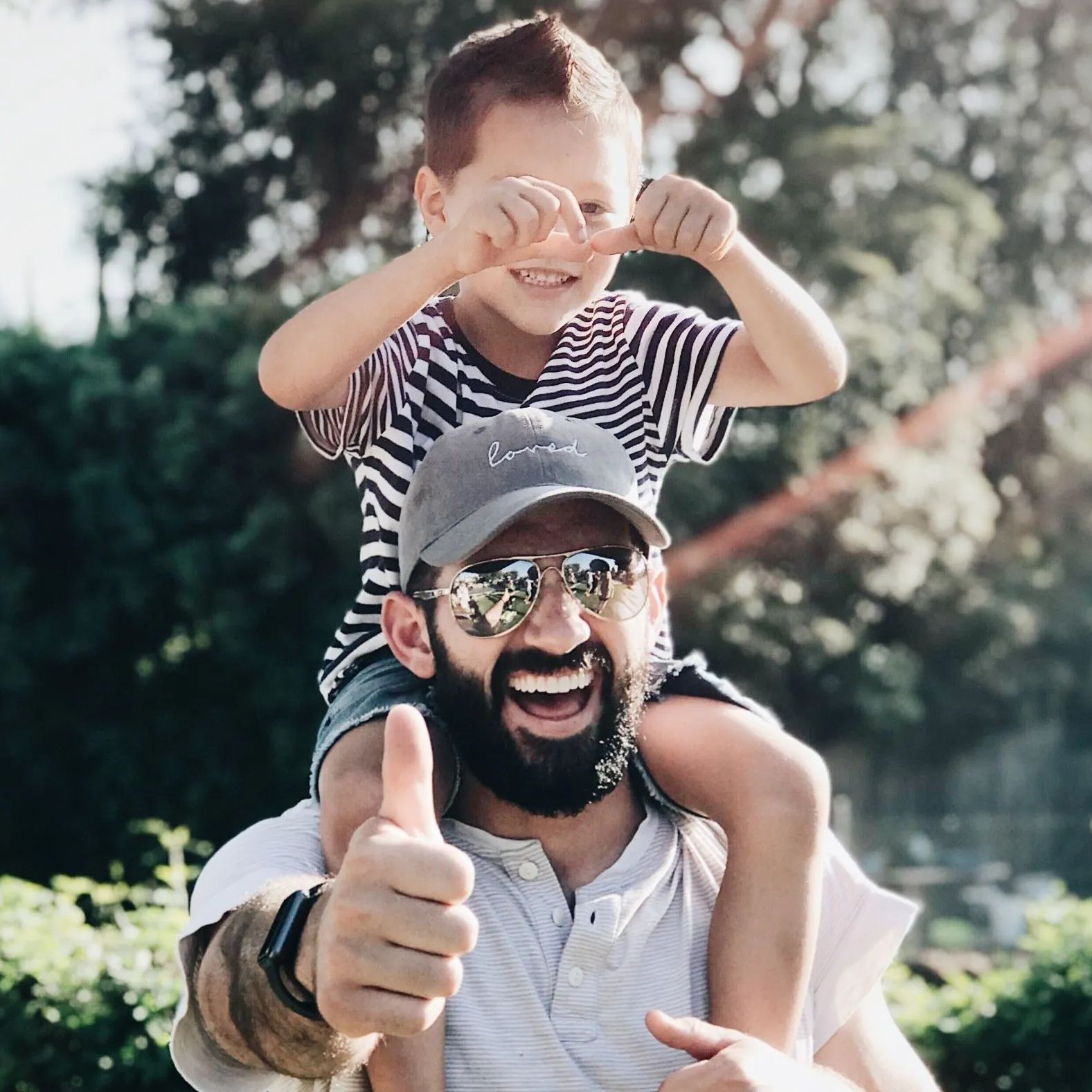 child on dad's shoulders