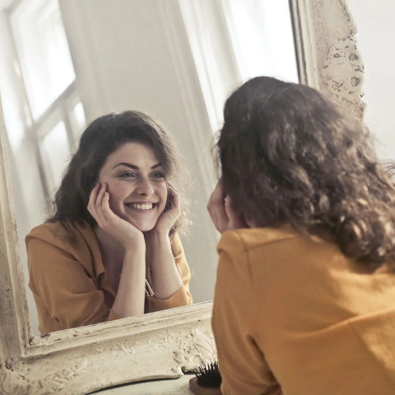 girl looking in mirror