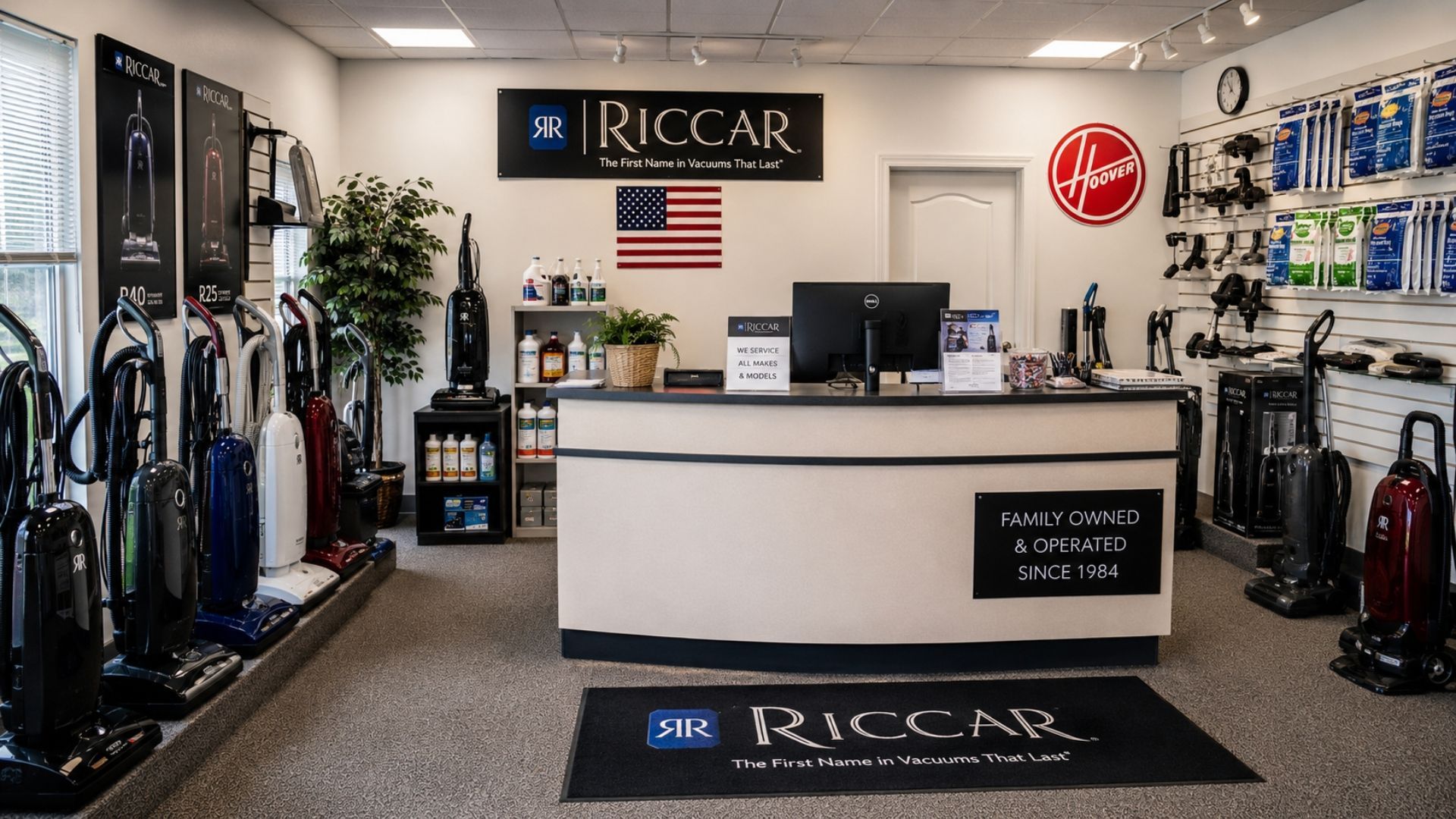 Interior of Riccar vacuum store showroom with displays, service counter, and vacuum cleaners on both sides