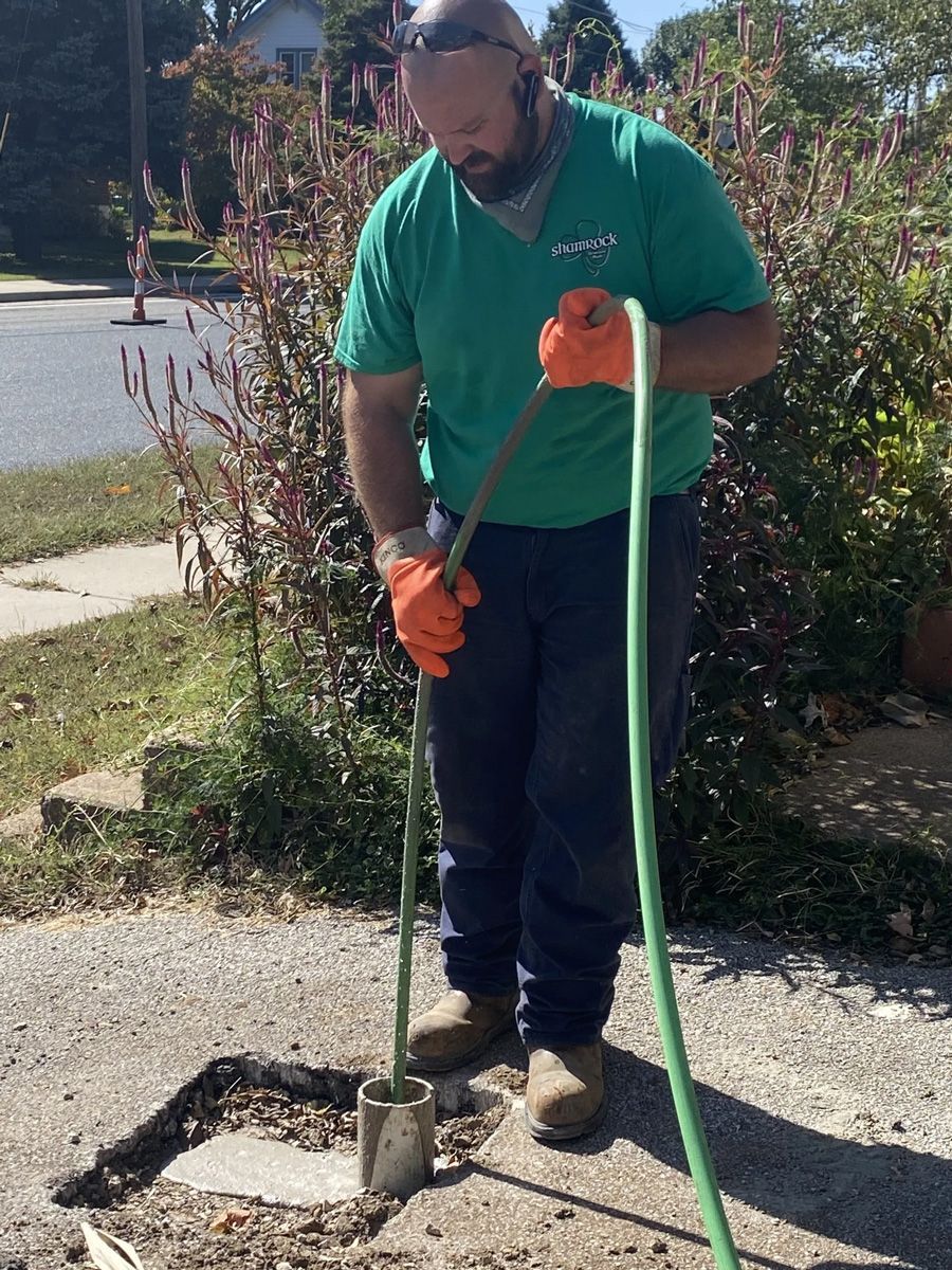Man Cleaning the Drain — St. Louis, MO — Shamrock Sewer & Drain