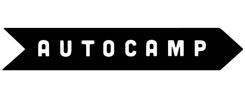 Black banner logo with white text reading “AUTOCAMP” and arrow-like ends