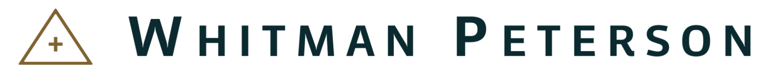 A whitman peterson logo on a white background