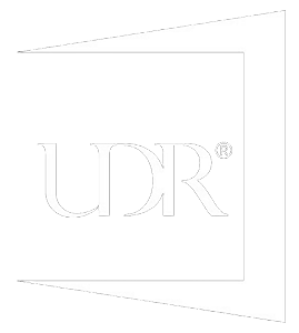 White UDR logo on a light gray background inside a square outline