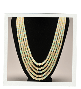 Multi-strand opal necklace on a black mannequin.