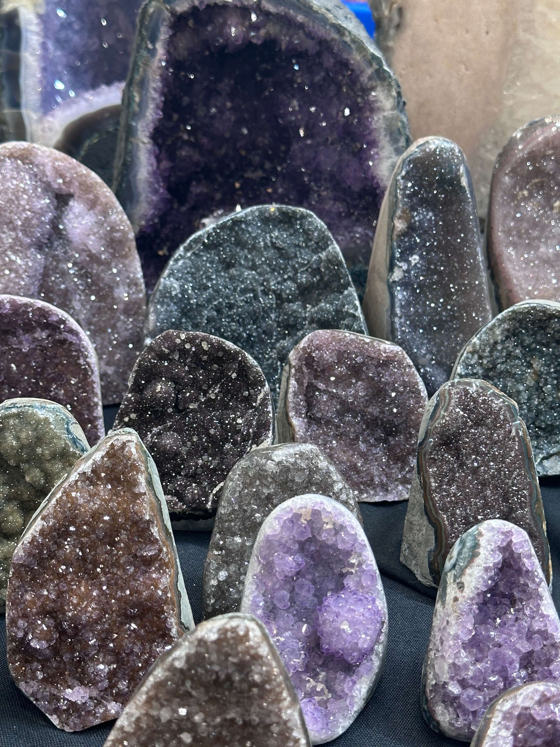 Amethyst crystal cluster with varying shades of purple and white.