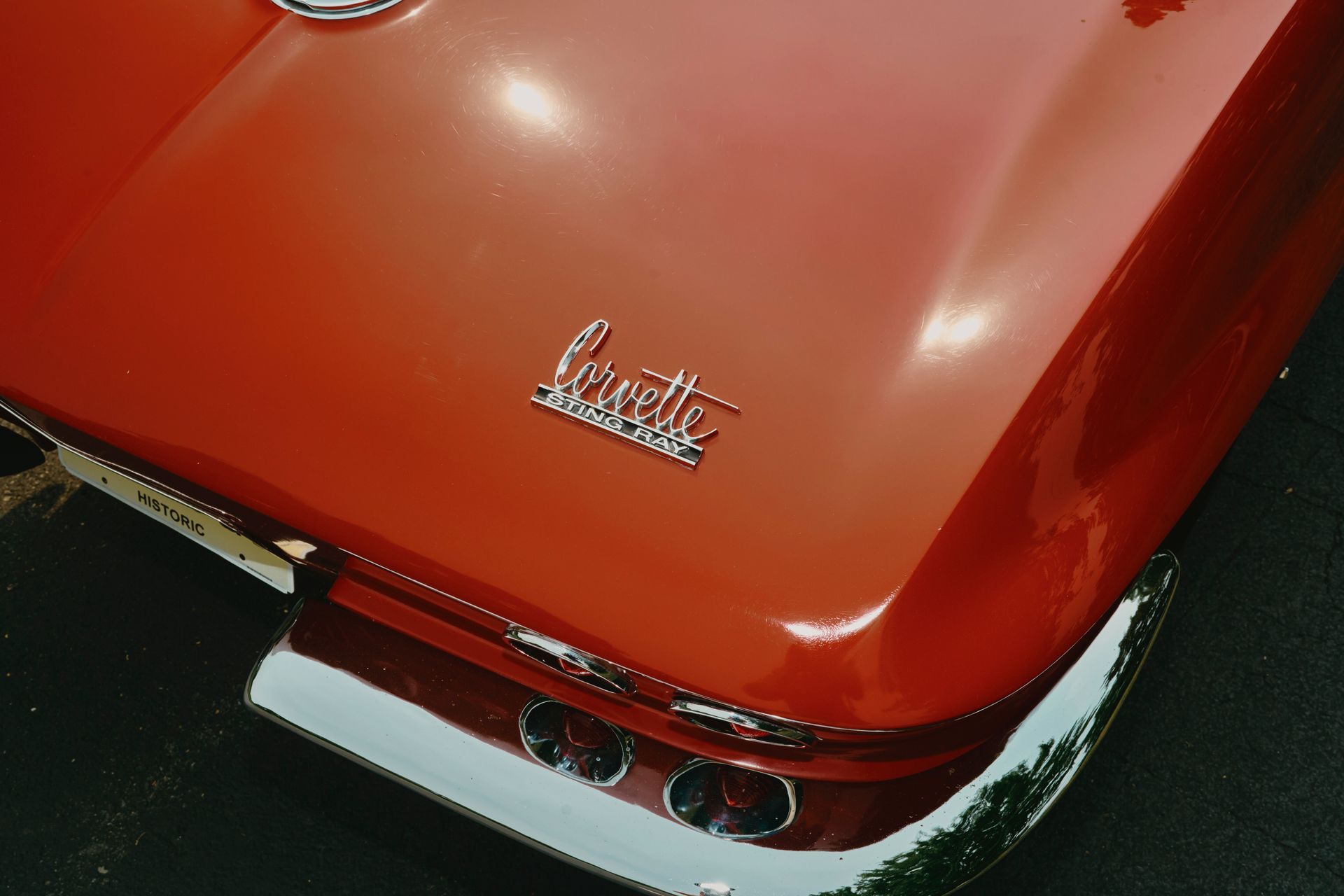 Red vintage Corvette rear end, chrome bumper, 