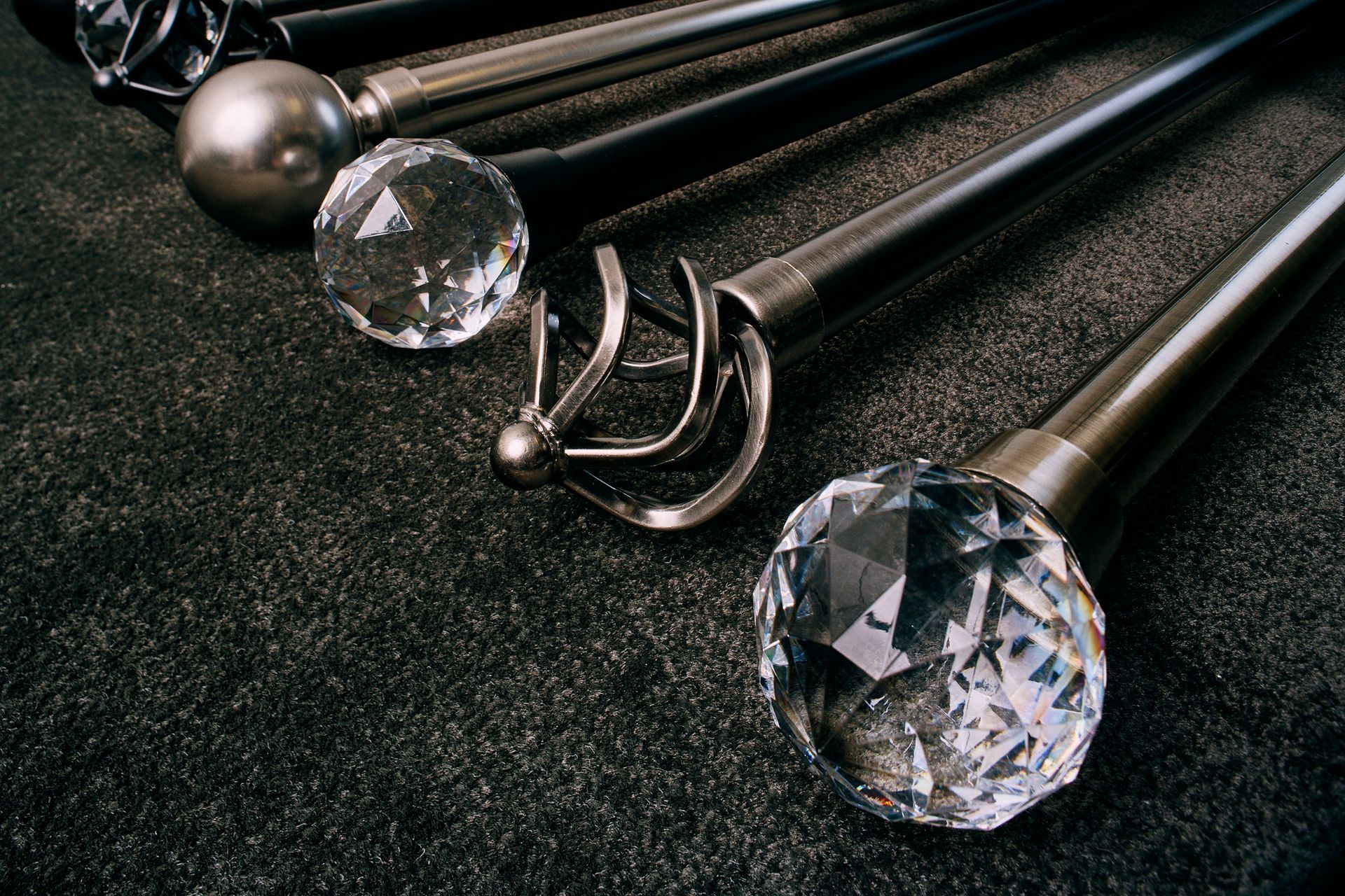 A bunch of curtain poles with crystals on them