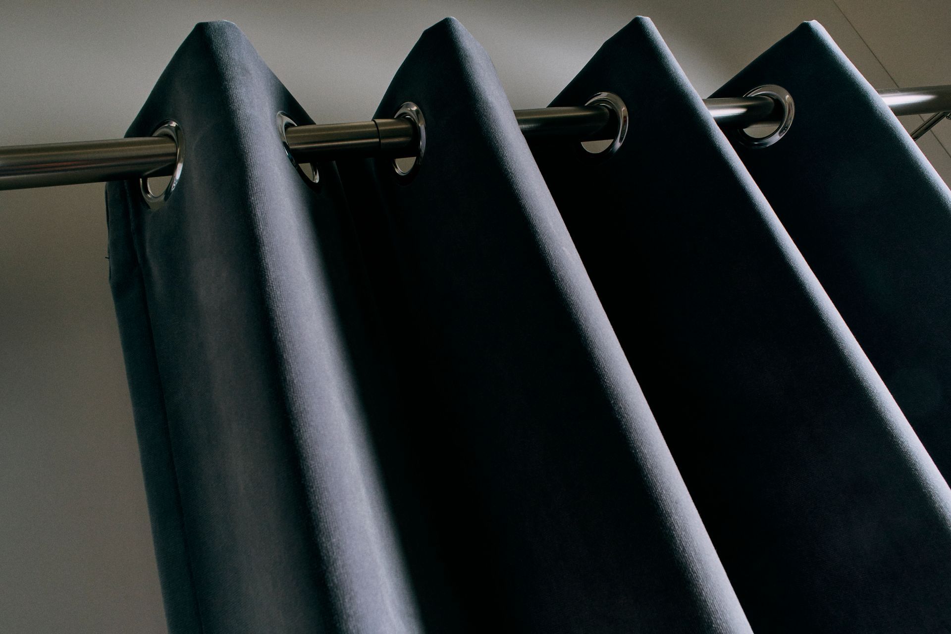 A close up of a pair of black curtains