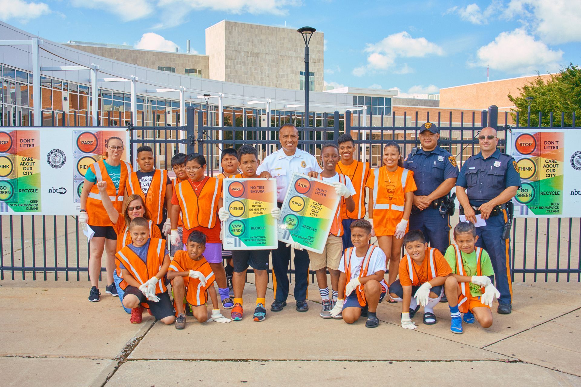 A group of children posing for a picture with a police officer