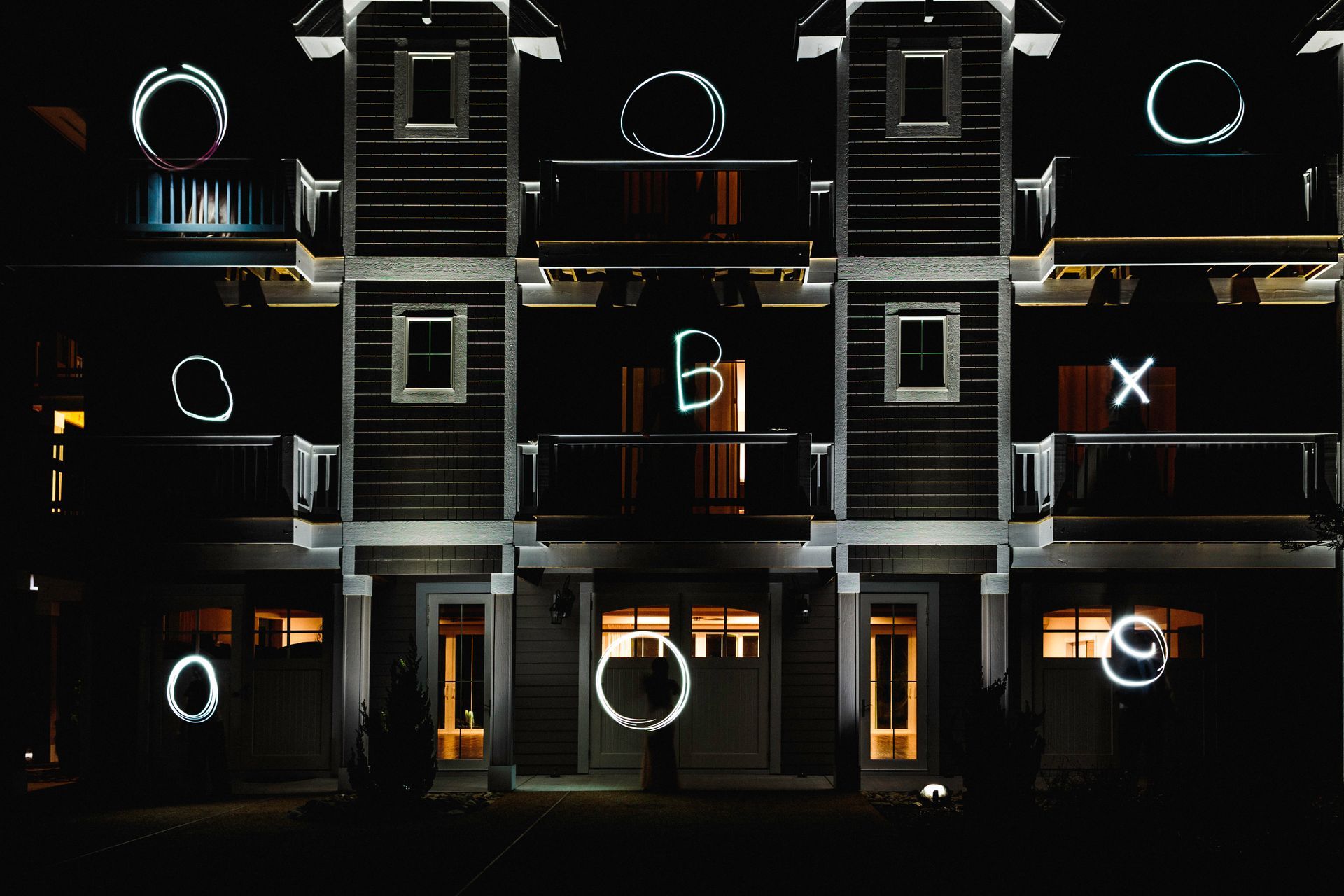A building with the letters b and x projected on it