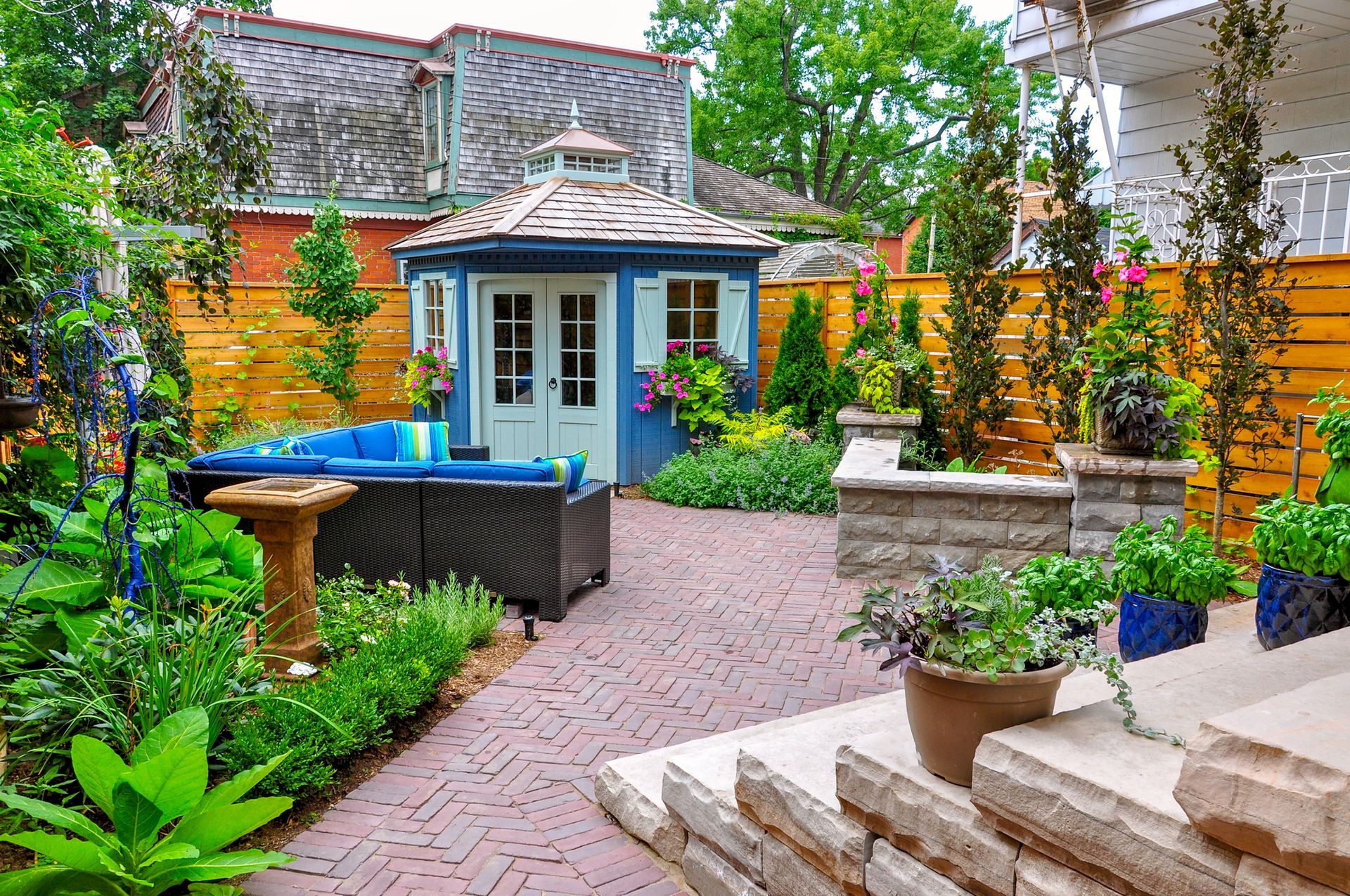 There is a gazebo in the middle of the backyard.