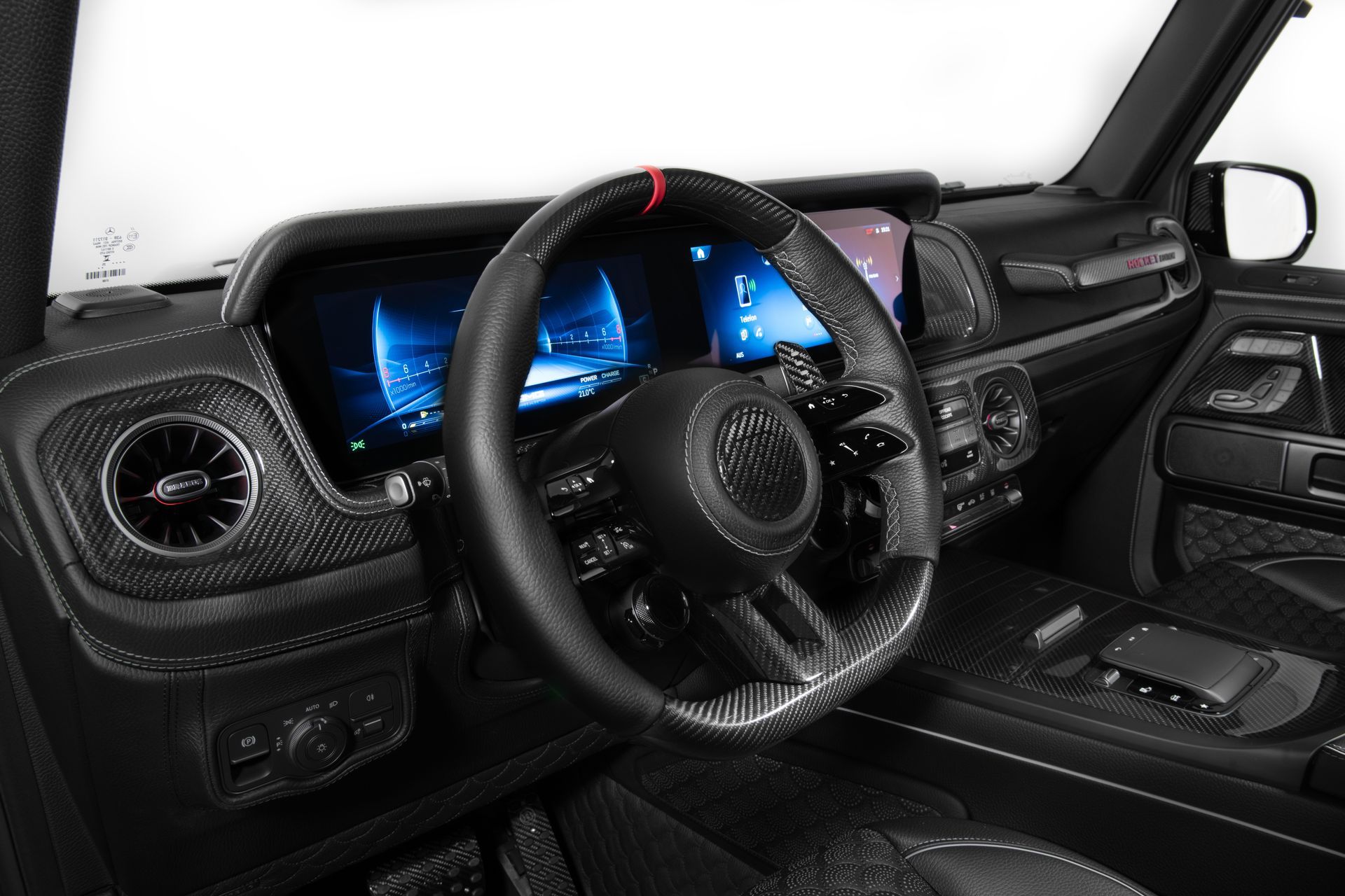 Rear view of a black high performance sports car with illuminated LED taillights in a modern garage.
