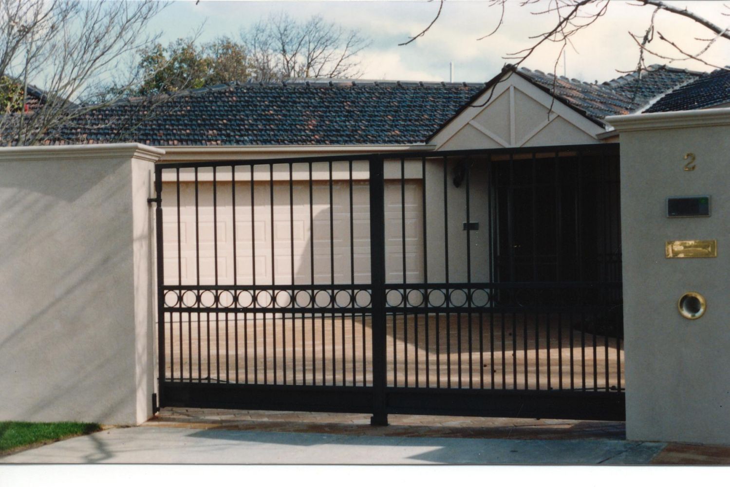 Swing Gates In Dark Blue Roof House - Cheltenham, VIC - Park Avenue Wrought Iron