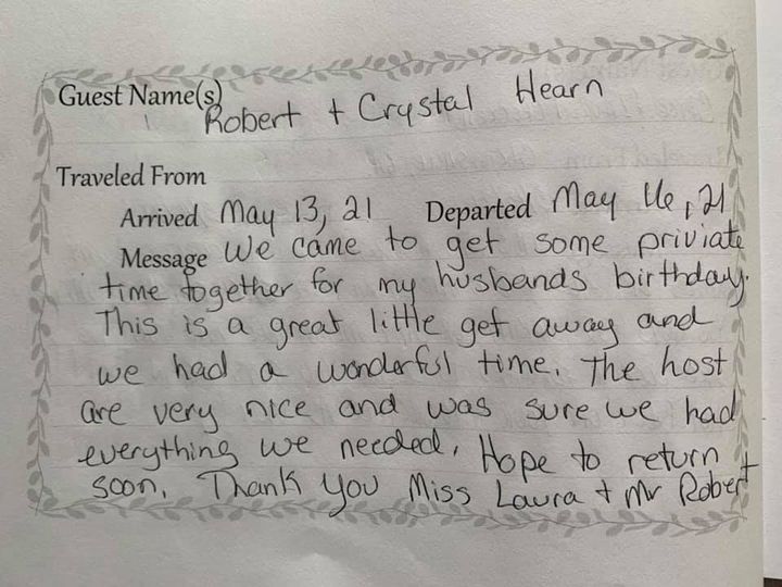 Guestbook page with handwritten note from Robert and Crystal, thanking Heather for the stay.