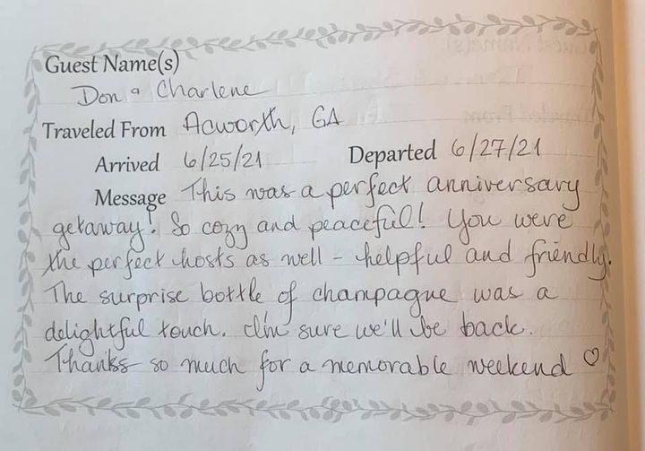 Handwritten guest note on lined paper thanking for a perfect anniversary getaway.
