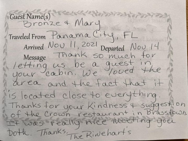 Handwritten guest note praising a cozy restaurant and thank-you for the kind staff.