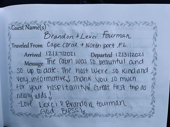 Handwritten guest note with names, travel dates, and a thank-you message on white paper