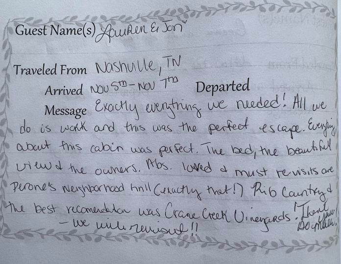 Handwritten guestbook note praising the venue, on a decorated page with floral border.