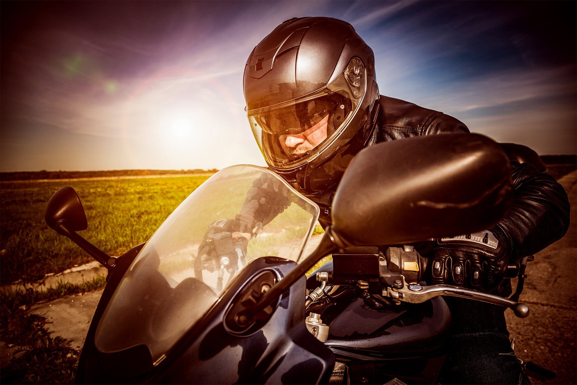 Male Biker Wearing Helmet and Leather Jacket