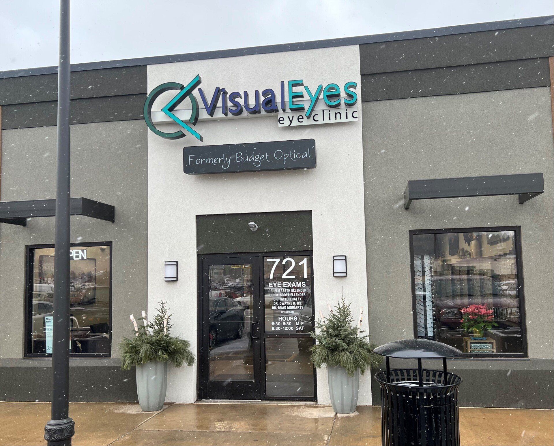 A building with a sign that says visual eyes eye clinic