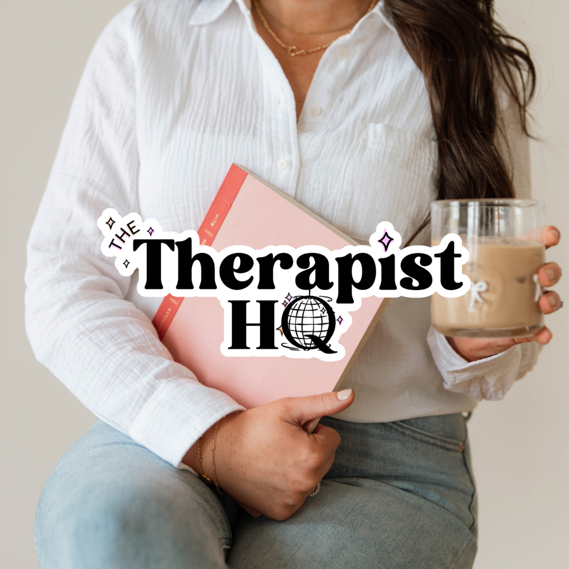 Person in a white shirt holding a pink book and iced coffee with “The Therapist HQ” text.