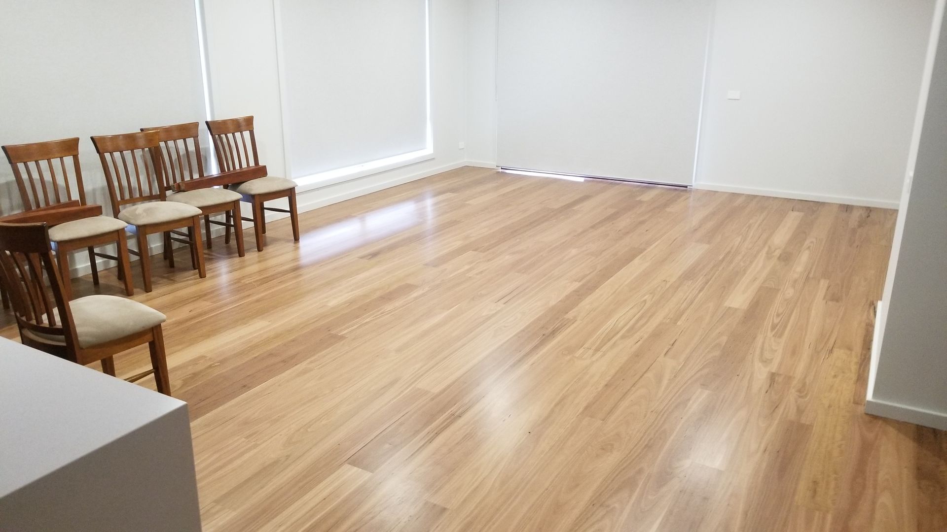A close up of a wooden floor in a room