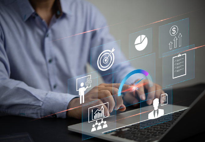 a man is typing on a laptop computer with a lot of icons coming out of it.