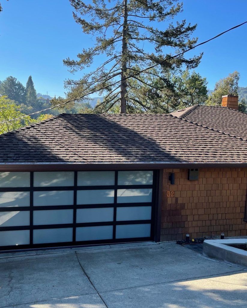 A brick house with a large garage door